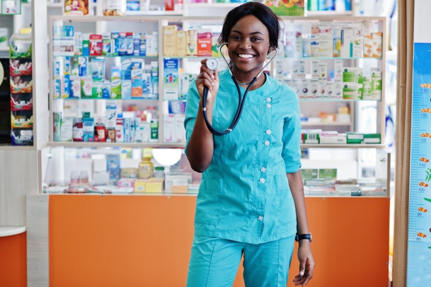 African american pharmacist working in drugstore at hospital pha